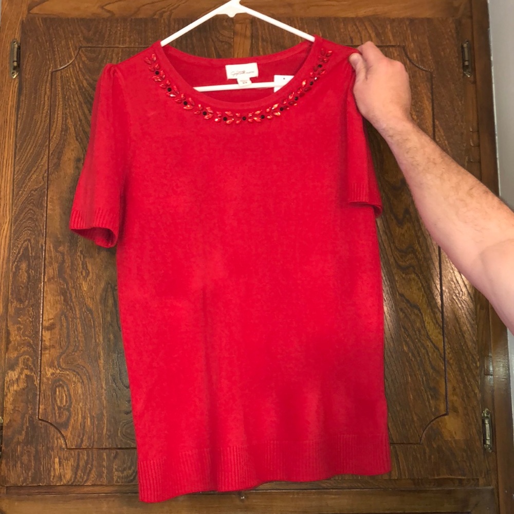 Red sweater.